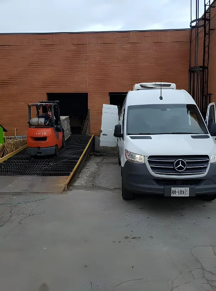 A Premium Foods van at the loading dock